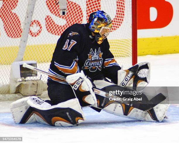 Olaf Kölzig of the Washington Capitals skates against the Toronto Maple Leafs during NHL game action on November 26, 2002 at Air Canada Centre in...