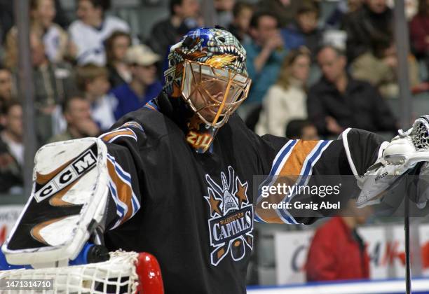 Olaf Kölzig of the Washington Capitals skates against the Toronto Maple Leafs during NHL game action on November 26, 2002 at Air Canada Centre in...