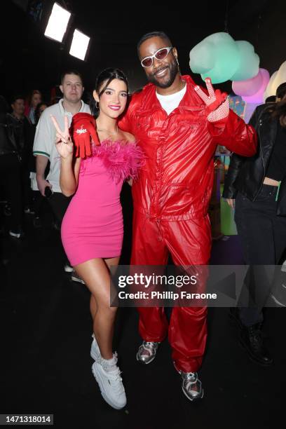 Charli D'Amelio and Nate Burleson attend the 2023 Nickelodeon Kids' Choice Awards at Microsoft Theater on March 04, 2023 in Los Angeles, California.