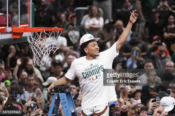 Nijel Pack of the Miami Hurricanes cuts down the net after defeating the Pittsburgh Panthers 78-76 to win a share of the ACC Championship at Watsco...