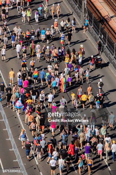 People take part in Pride March over the Sydney Harbour Bridge on March 05, 2023 in Sydney, Australia. 50,000 people marched across the iconic Sydney...
