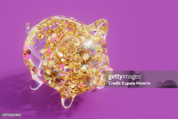 glowing glass piggy bank with gold dollar coins - welvaart stockfoto's en -beelden