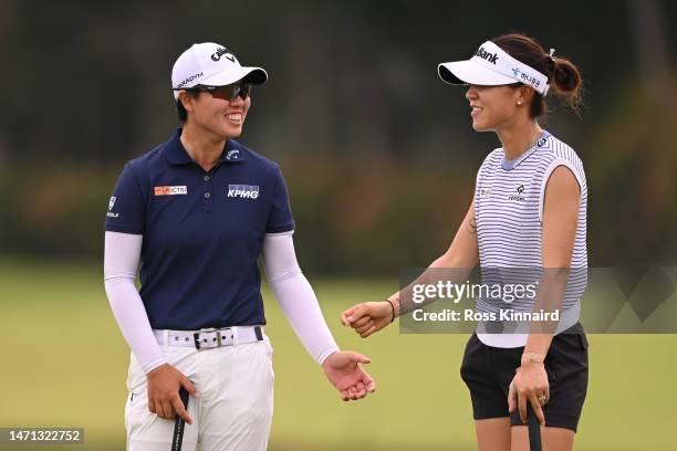 Yuka Saso of Japan and Lydia Ko of New Zealand interact on the fifth green during Day Four of the HSBC Women's World Championship at Sentosa Golf...