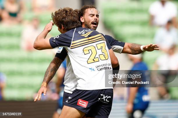 Andrew Muirhead and Ollie Sapsford of the Brumbies celebrates victory during the round two Super Rugby Pacific match between Blues and ACT Brumbies...