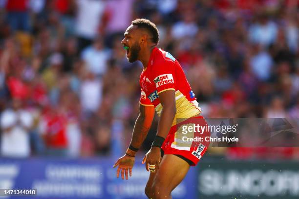 Hamiso Tabuai-Fidow of the Dolphins celebartes a try during the round one NRL match between the Dolphins and Sydney Roosters at Suncorp Stadium on...