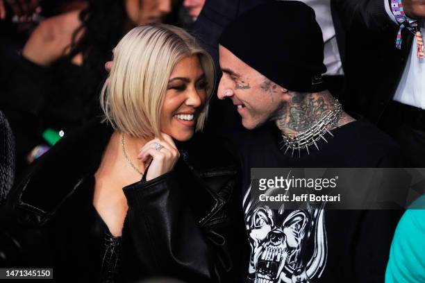 Kourtney Kardashian and Travis Barker attend the UFC 285 event at T-Mobile Arena on March 04, 2023 in Las Vegas, Nevada.