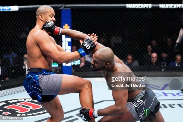 Jon Jones punches Ciryl Gane of France in the UFC heavyweight championship fight during the UFC 285 event at T-Mobile Arena on March 04, 2023 in Las...