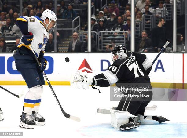 Joonas Korpisalo of the Los Angeles Kings makes a save in front of Brayden Schenn of the St. Louis Blues during a 4-2 Kings win at Crypto.com Arena...