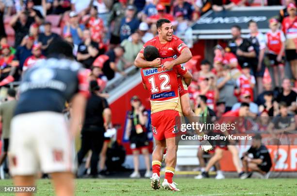 Sean O'Sullivan and Kenny Bromwich of the Dolphins celebrate the Dolphins first ever victory in the NRL after the round one NRL match between the...