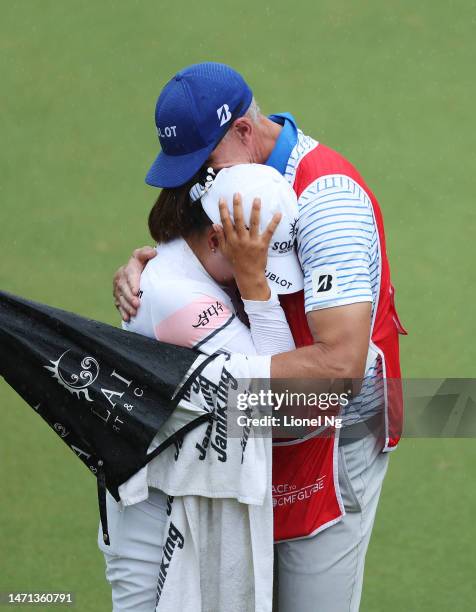 Jin Young Ko of South Korea celebrates with her caddie on the eighteenth green after winning the HSBC Women's World Championship at Sentosa Golf Club...