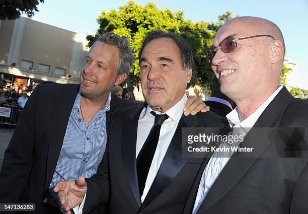 Producer Eric Kopeloff, director Oliver Stone and producer Moritz Borman arrive at Premiere of Universal Pictures' "Savages" at Westwood Village on...