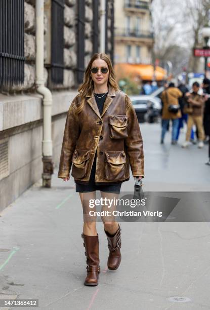 Pernille Teisbaek wears brown jacket, dress, bag, boots outside Hermes during Paris Fashion Week - Womenswear Fall Winter 2023 2024 : Day Six on...