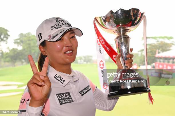 Jin Young Ko of South Korea poses with the trophy after winning the HSBC Women's World Championship during Day Four of the HSBC Women's World...