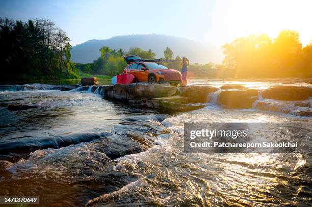 road trip - car splashing water on people stock pictures, royalty-free photos & images