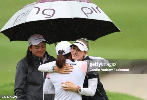 Jin Young Ko of South Korea is congratulated by Nelly Korda of The United States and Allisen Corpuz of the United States on the eighteenth green...
