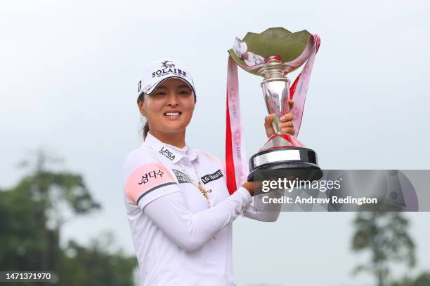 Jin Young Ko of South Korea poses with the trophy after winning the HSBC Women's World Championship during Day Four of the HSBC Women's World...