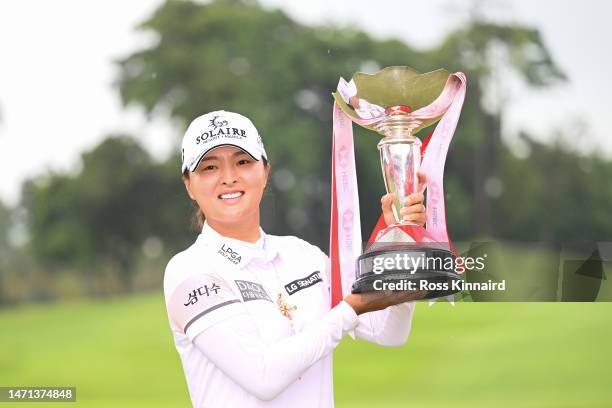 Jin Young Ko of South Korea poses with the trophy after winning the HSBC Women's World Championship during Day Four of the HSBC Women's World...