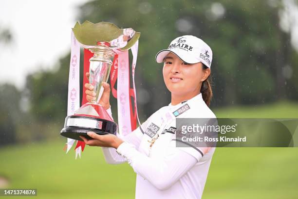 Jin Young Ko of South Korea poses with the trophy after winning the HSBC Women's World Championship during Day Four of the HSBC Women's World...