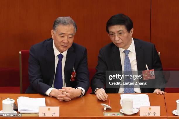 Wang Yang, chairman of the National Committee of the Chinese People's Political Consultative Conference talk with Wang Huning, a member of the...