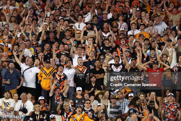 Tigers fans react during the round one NRL match between the Wests Tigers and the Gold Coast Titans at Leichhardt Oval on March 05, 2023 in Sydney,...