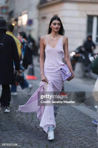 Neelam Kaur Gill seen wearing a rose long dress, rose boots and a purple Victoria Beckham handbag outside Victoria Beckham, during Pariser Fashion...