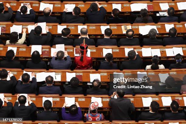 Delegates gather during the opening of the first session of the 14th National People's Congress at The Great Hall of People on March 5, 2023 in...