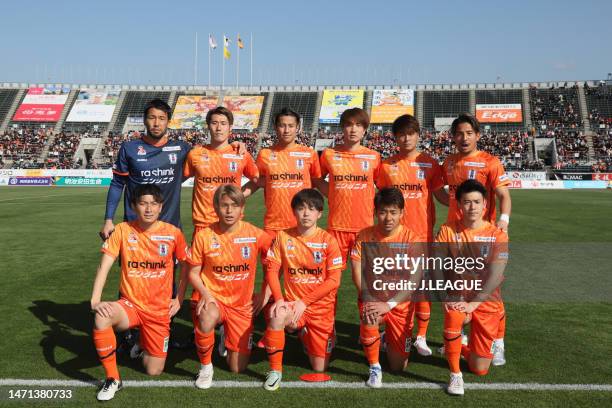 Ehime FC players line up for the team photos prior to the J.LEAGUE Meiji Yasuda J3 1st Sec. Match between Ehime FC and Iwate Grulla Morioka at...