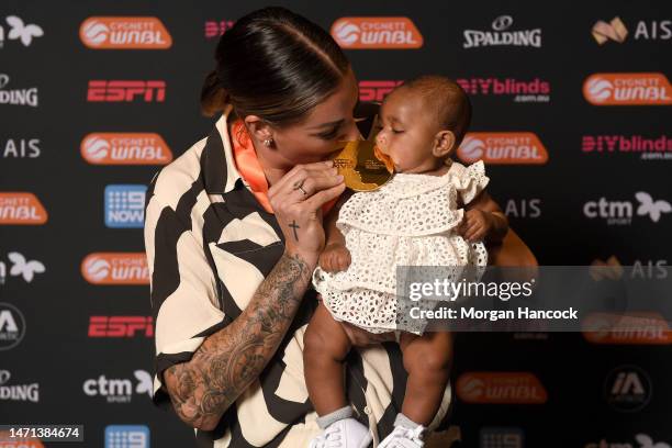 Cayla George of the Boomers poses with her daughter Pearl after winning the Suzy Batkovic Medal for the WNBL MVP during the 2023 WNBL Awards Night at...