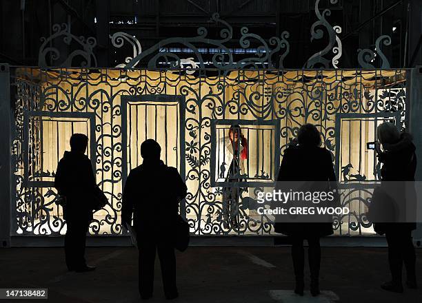 Members of the media inspect an installation by Canadian artist Cal Lane, on Cockatoo Island near Sydney during a preview of the 18th Biennale of...