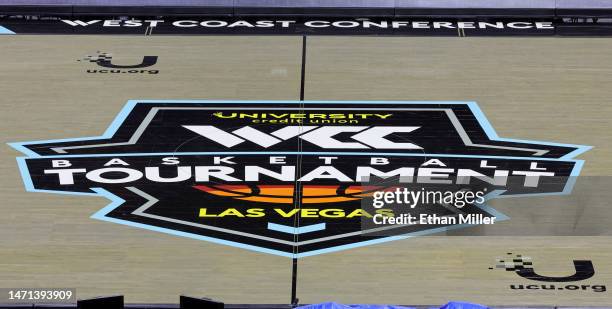 West Coast Conference basketball tournament logo is shown on the court after a quarterfinal game between the San Francisco Dons and the Santa Clara...
