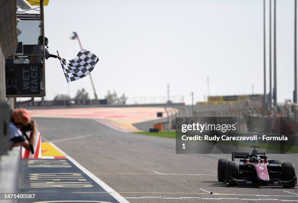 Race winner Theo Pourchaire of France and ART Grand Prix takes the chequered flag during the Round 1:Sakhir Feature race of the Formula 2...