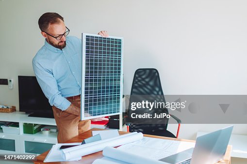 Engineer explaining about solar panel system at video call with his colleagues Engineer explaining about solar panel system at video call with his colleagues