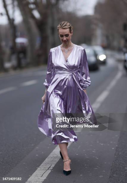 Marina von Lison seen wearing long purple RVNG couture dress, silver glitter Helena Joy Joaillerie jewelry, small colorful Emm Kuo bag, black with...