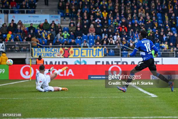 Bryan Lasme of Bielefeld scores his teams second goal against Jasmin Fejzic of Braunschweig during the Second Bundesliga match between Eintracht...