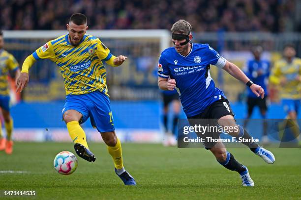 Fabian Klos of Bielefeld and Hasan Kurucay of Braunschweig fight for the ball during the Second Bundesliga match between Eintracht Braunschweig and...