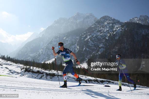 Andrew Musgrave of Great Britain abd Olzhas Klimin of Kazakhstan compete during the Cross-Country Men's 50km Mass Start Classic at the FIS Nordic...