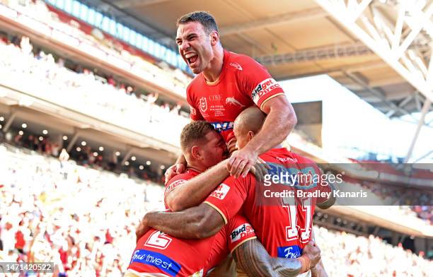 Jamayne Isaako of the Dolphins is congratulated by team mates after scoring a try during the round one NRL match between the Dolphins and Sydney...