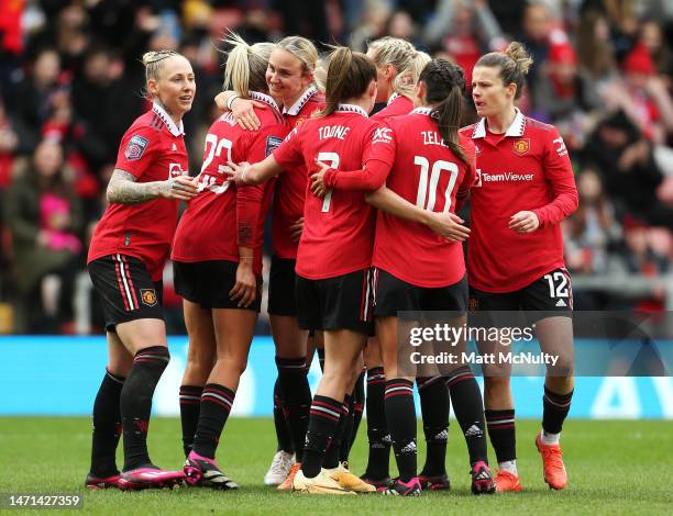 Alessia Russo of Manchester United celebrates scoring the side's third and her hat-trick goal with teammates during the FA Women's Super League match...