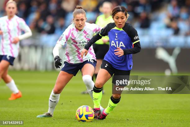 Mana Iwabuchi of Tottenham Hotspur runs with the ball whilst under pressure from Filippa Angeldal of Manchester City during the FA Women's Super...