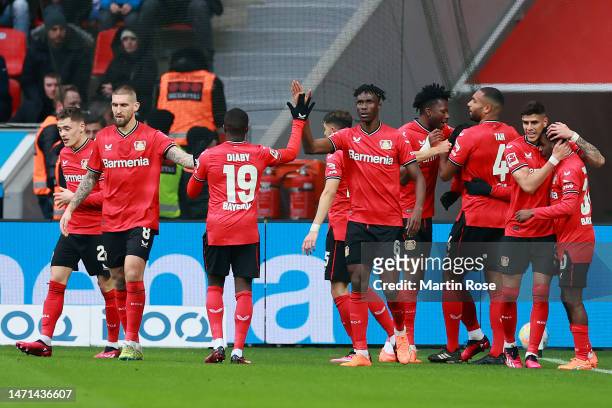 Sardar Azmoun of Bayer 04 Leverkusen celebrates with teammates after scoring the team's first goal during the Bundesliga match between Bayer 04...