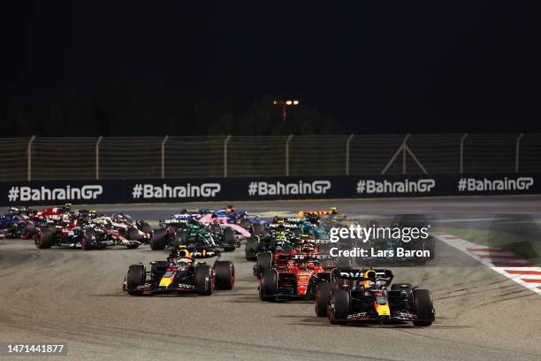 Max Verstappen of the Netherlands driving the Oracle Red Bull Racing RB19 leads Charles Leclerc of Monaco driving the Ferrari SF-23 and the rest of...