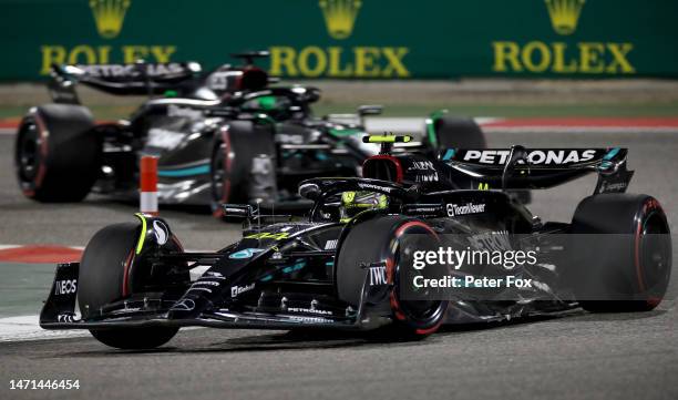 Lewis Hamilton of Great Britain driving the Mercedes AMG Petronas F1 Team W14 leads George Russell of Great Britain driving the Mercedes AMG Petronas...