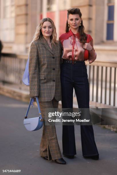 Michalka seen wearing a matching suit with an oversized patterned blazer and pants, a purple bag and black boots and Aly Michalka seen wearing high...