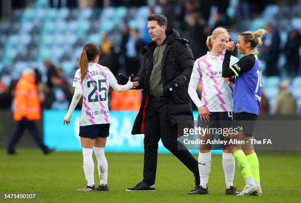Gareth Taylor, Manager of Manchester City, interacts with Yui Hasegawa of Manchester City following the FA Women's Super League match between...