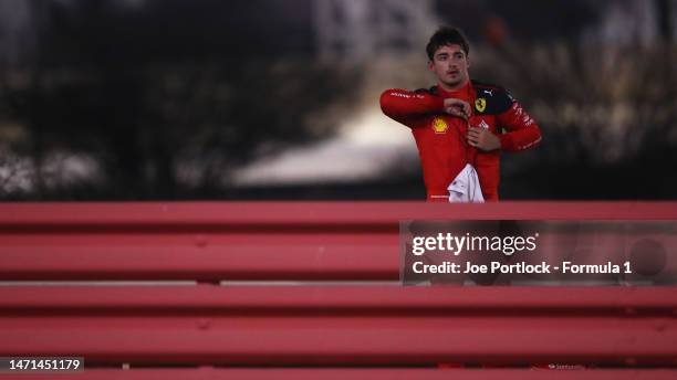 Charles Leclerc of Monaco and Ferrari looks on after retiring from the race during the F1 Grand Prix of Bahrain at Bahrain International Circuit on...