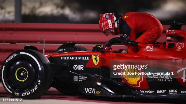 Charles Leclerc of Monaco and Ferrari climbs from his car after retiring from the race during the F1 Grand Prix of Bahrain at Bahrain International...