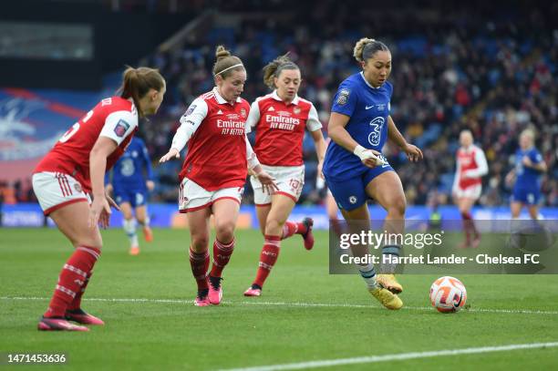 Lauren James of Chelsea is challenged by Noelle Maritz, Kim Little, and Katie McCabe of Arsenal during the FA Women's Continental Tyres League Cup...