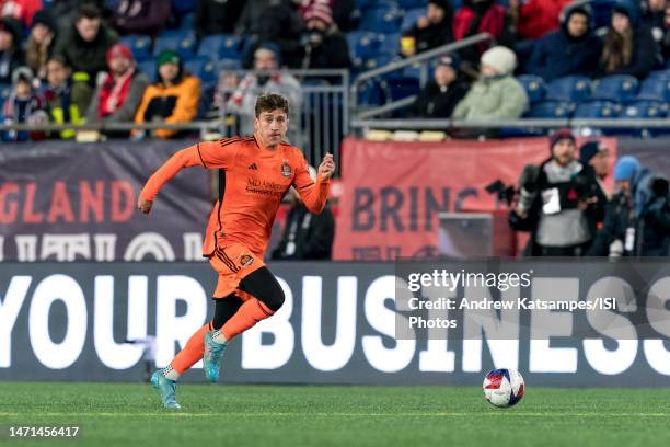 Franco Escobar of Houston Dynamo FC brings the ball forward during a game between Houston Dynamo and New England Revolution at Gillette Stadium on...