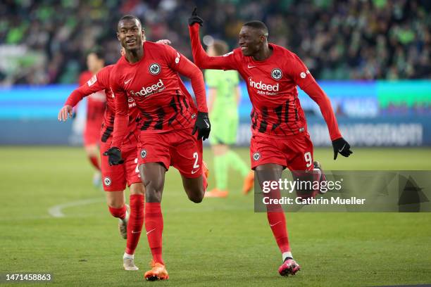 Evan Ndicka of Eintracht Frankfurt celebrates after scoring the team's second goal during the Bundesliga match between VfL Wolfsburg and Eintracht...