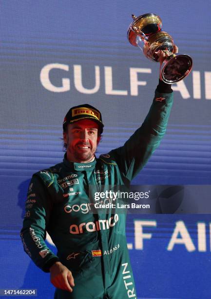 Third placed Fernando Alonso of Spain and Aston Martin F1 Team celebrates on the podium during the F1 Grand Prix of Bahrain at Bahrain International...